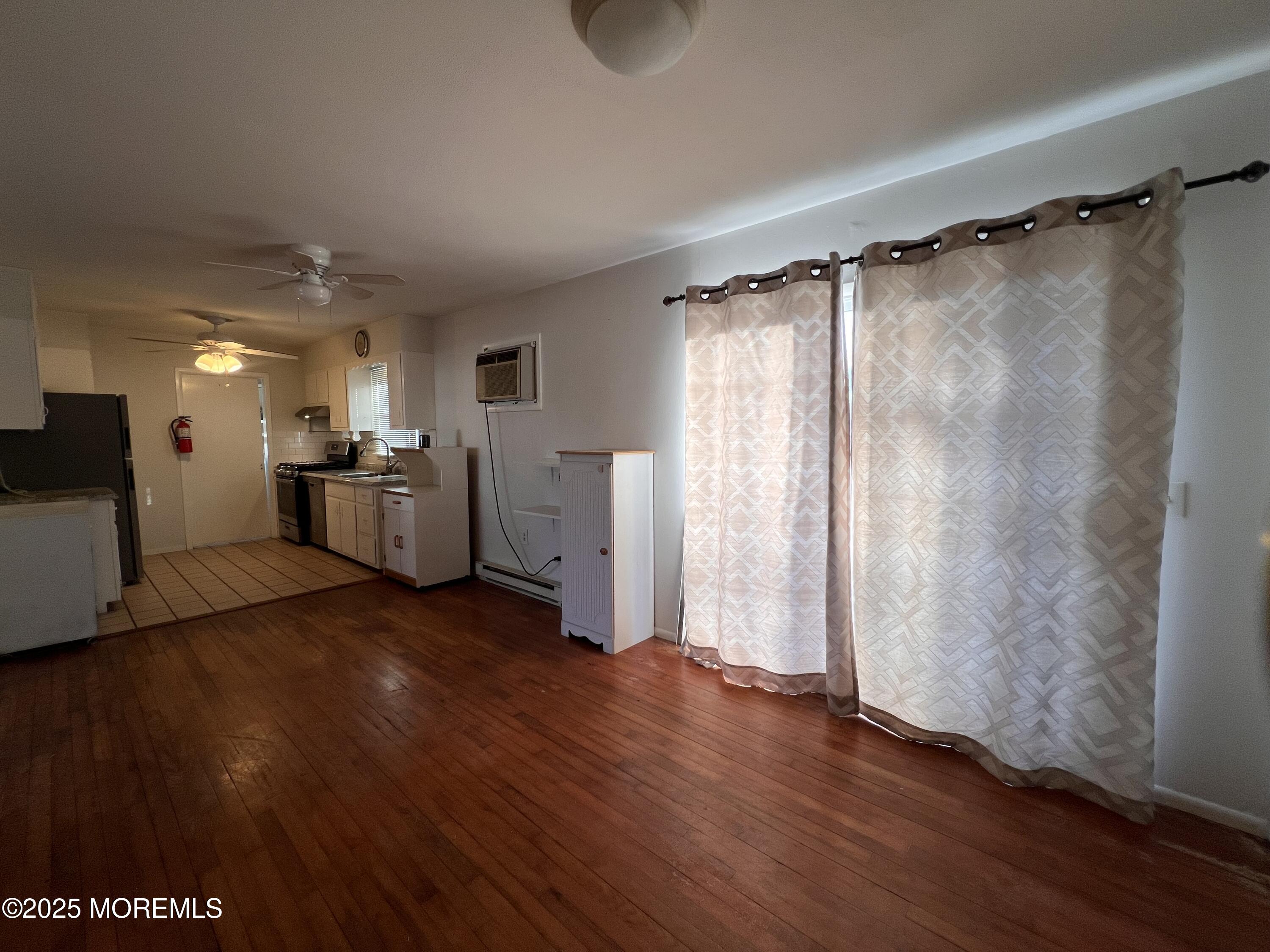 17 Afton Road Jackson, NJ 08527 - Photo 16 of 21 a view of empty room with wooden floor and fan