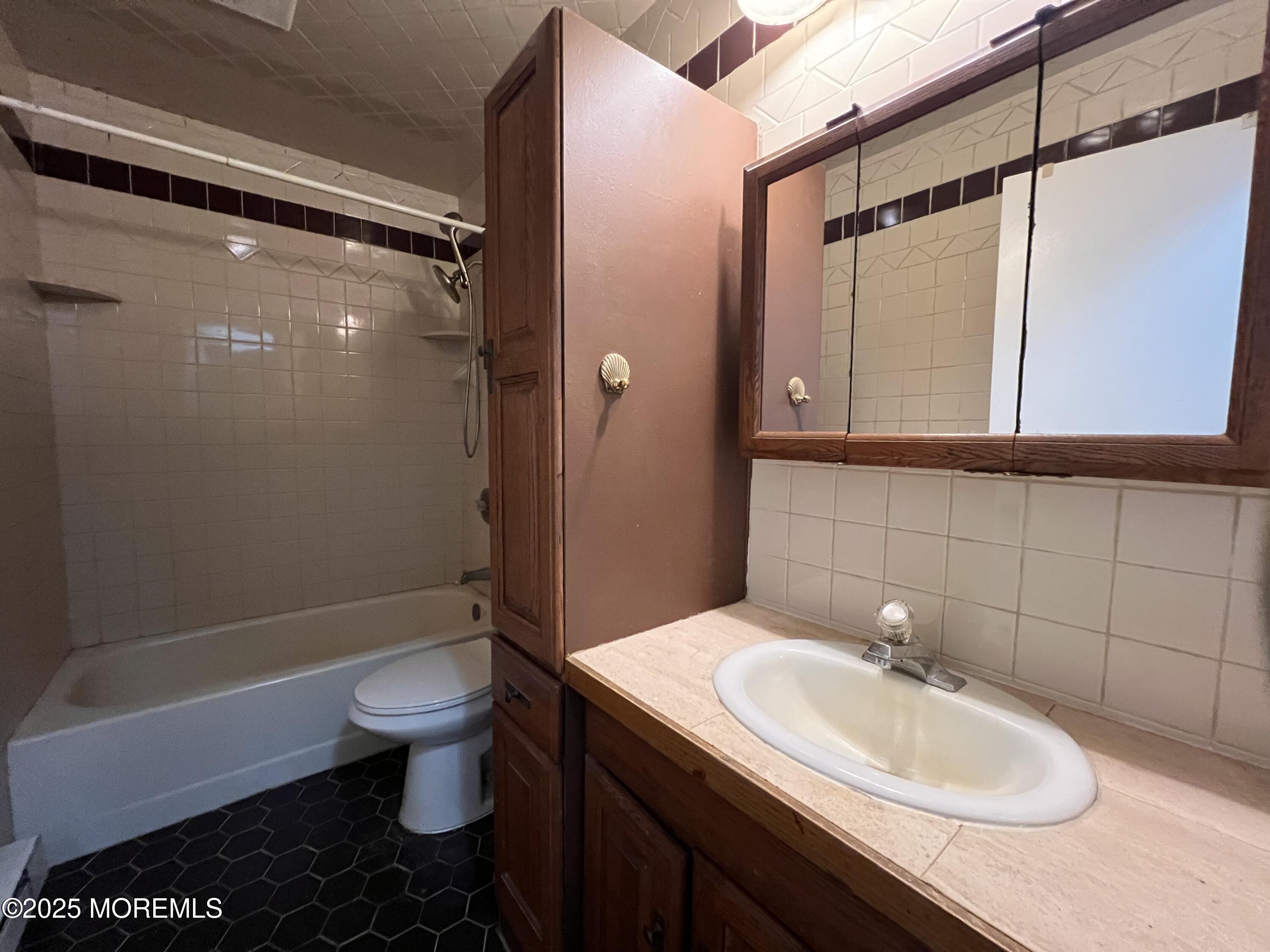 17 Afton Road Jackson, NJ 08527 - Photo 2 of 21 a bathroom with a sink toilet and shower