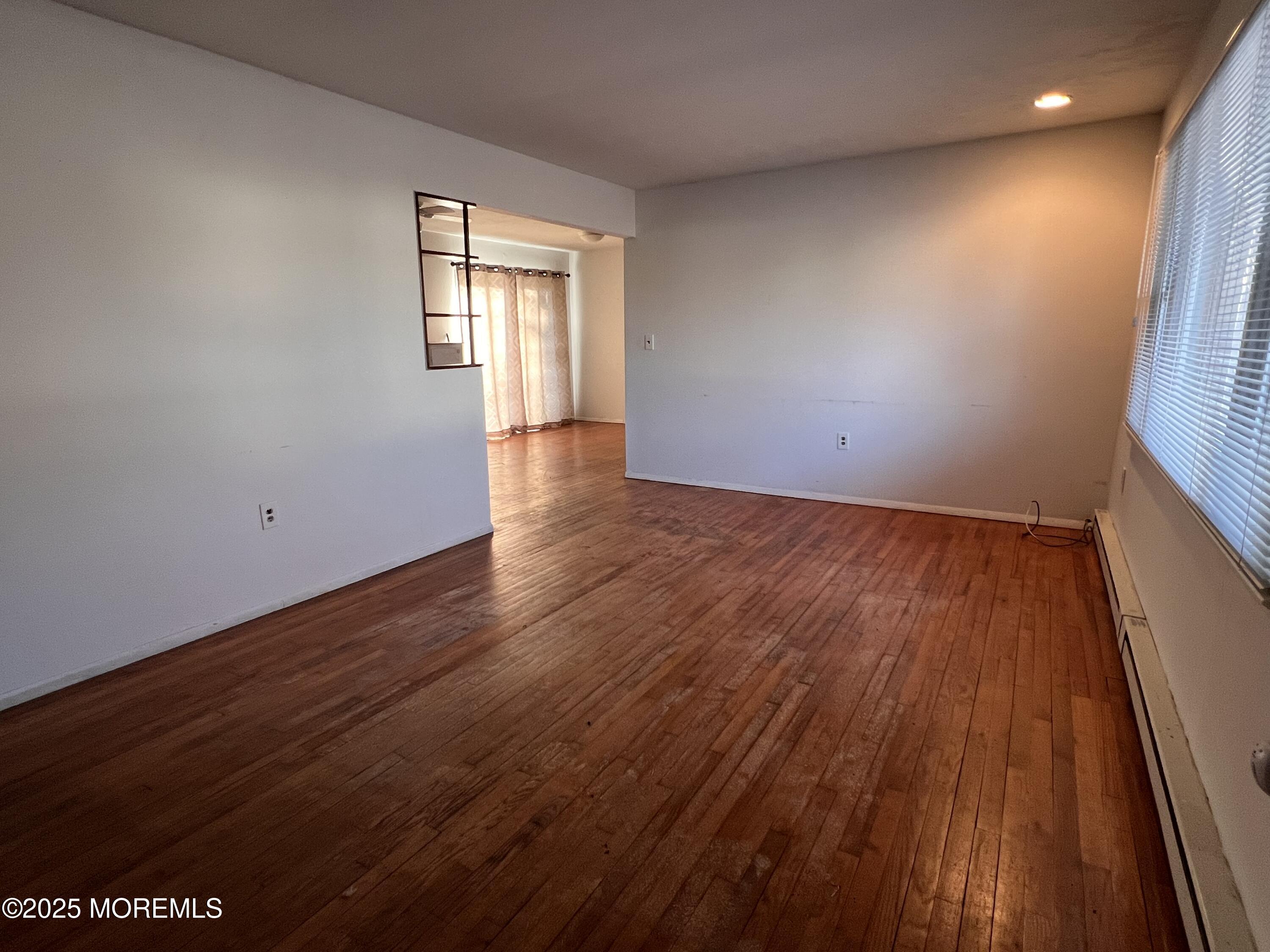 17 Afton Road Jackson, NJ 08527 - Photo 21 of 21 wooden floor in an empty room with a window