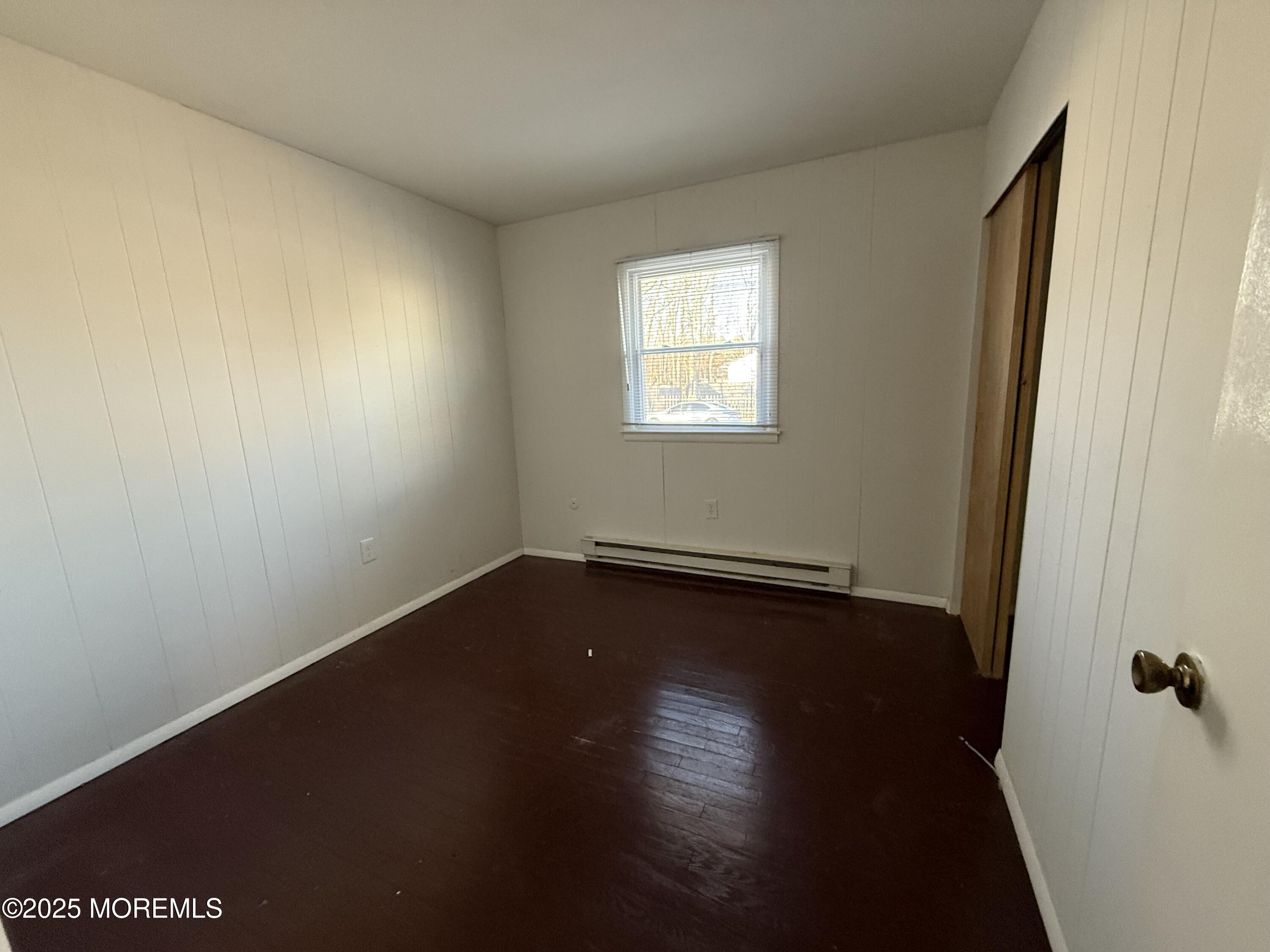 17 Afton Road Jackson, NJ 08527 - Photo 7 of 21 a view of a room with wooden floor and a window