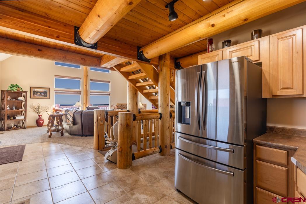 1737 Roberts Ridge Drive Hesperus, CO 81326 - Photo 6 of 34 a metallic refrigerator freezer sitting in a kitchen