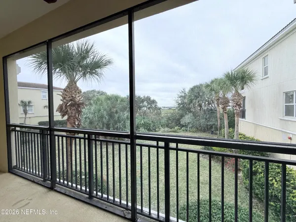 a view of a balcony with wooden floor