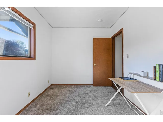 a room with a wooden floor and furniture