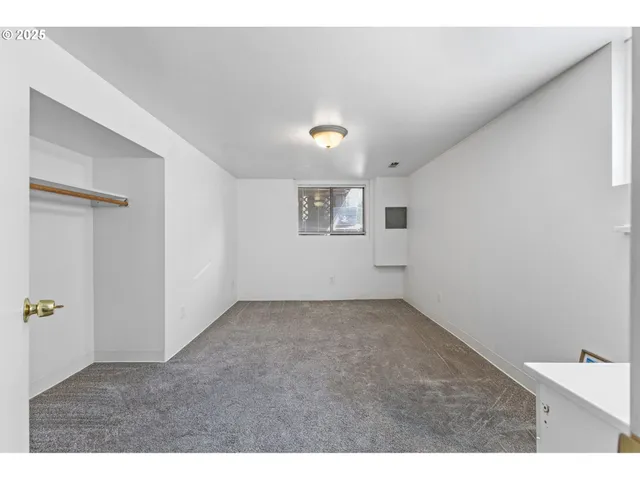 a utility room with cabinets washer and dryer