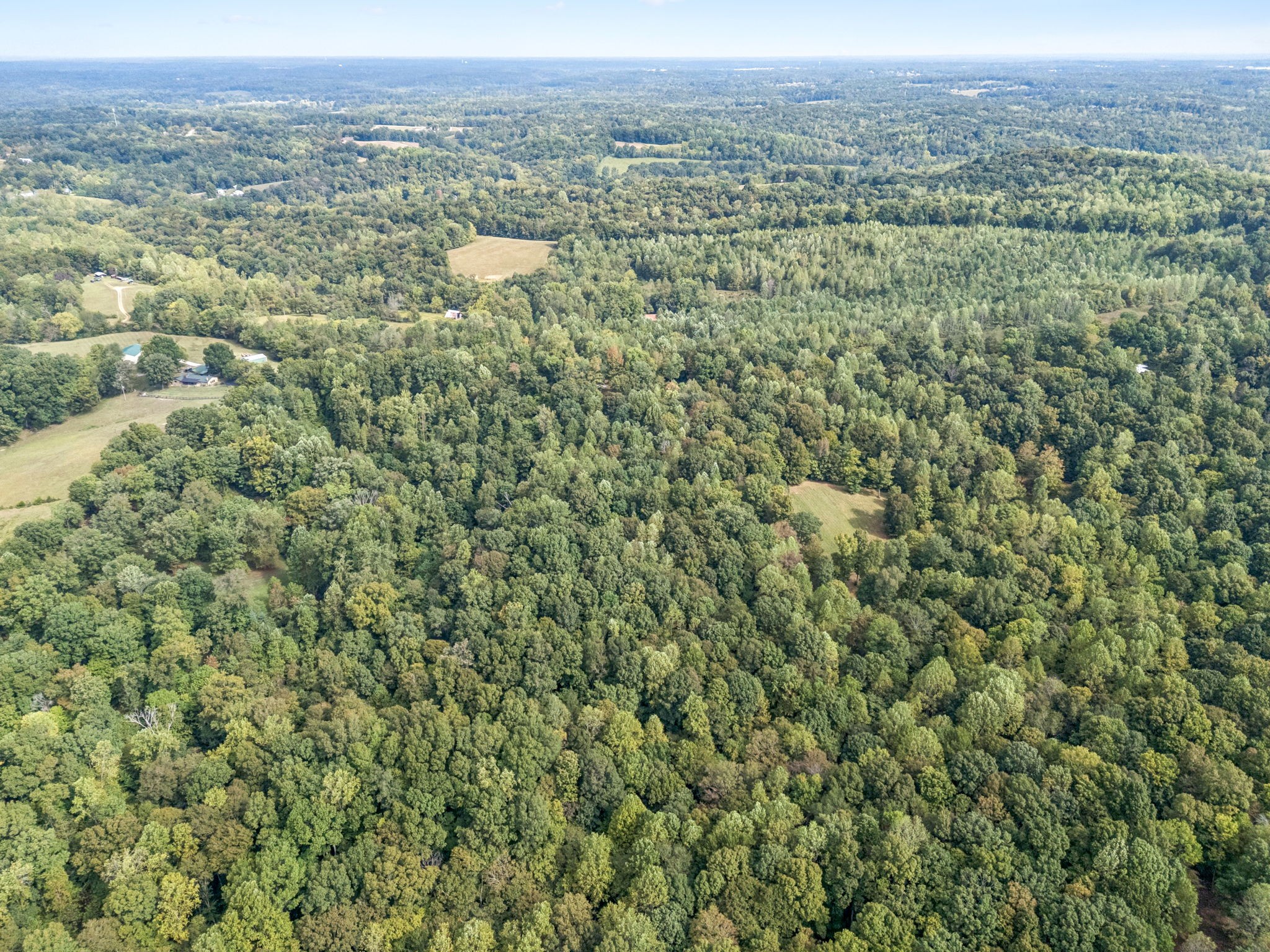0 Tidwell Switch Road Bon Aqua, TN 37025 - Photo 13 of 13 a view of a city with lush green forest