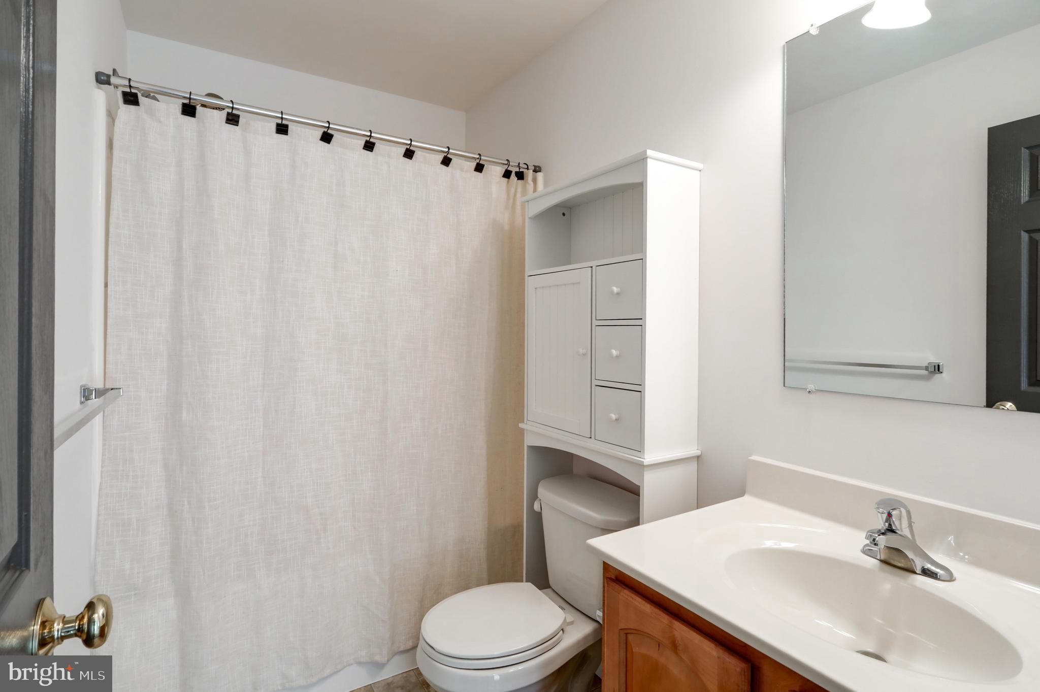 616 Wagonwheel Road Lititz, PA 17543 - Photo 33 of 40 a white toilet sitting next to a bathroom sink