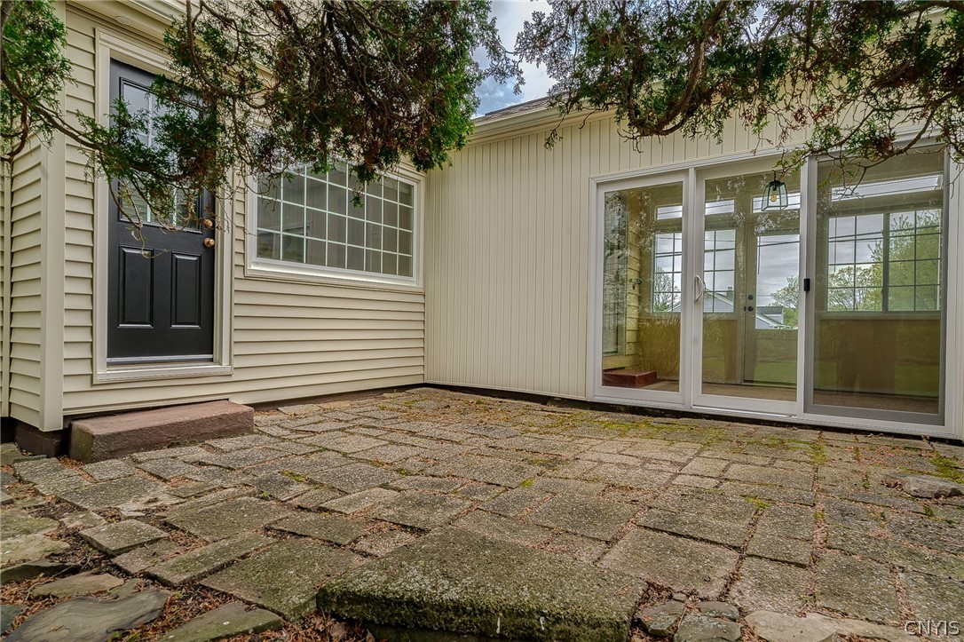 110 Ardmore Road Geddes, NY 13219 - Photo 47 of 50 Stone patio off the breezeway and dining area- suc