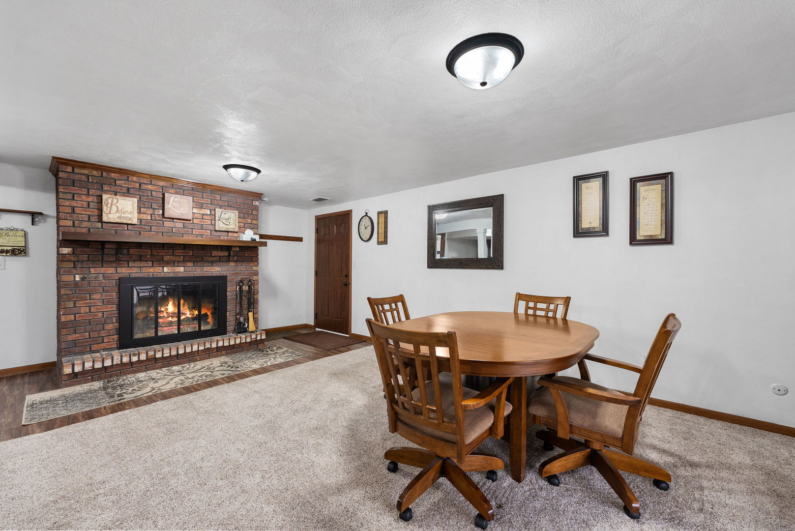 110 Andrea Court Cleveland, IL 61241 - Photo 20 of 23 a dining room with furniture and a fireplace