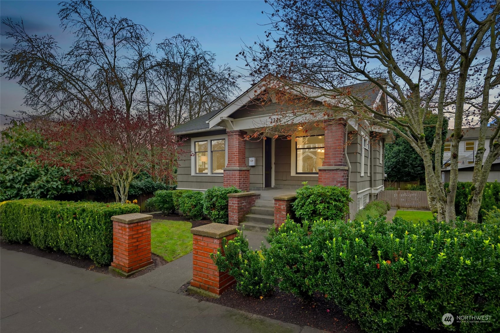 2226 12th Avenue East Seattle, WA 98102 - Photo 1 of 37 a front view of a house with garden