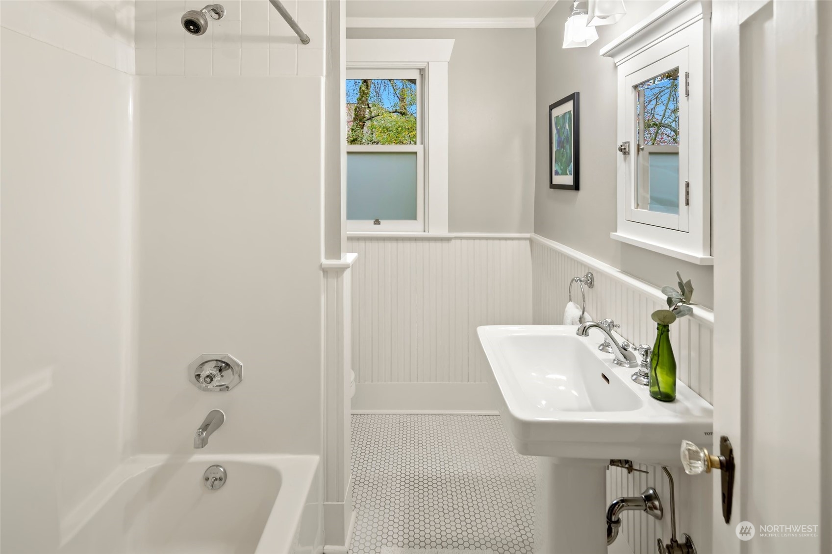 2226 12th Avenue East Seattle, WA 98102 - Photo 14 of 37 a bathroom with a sink a bathtub and next to a window