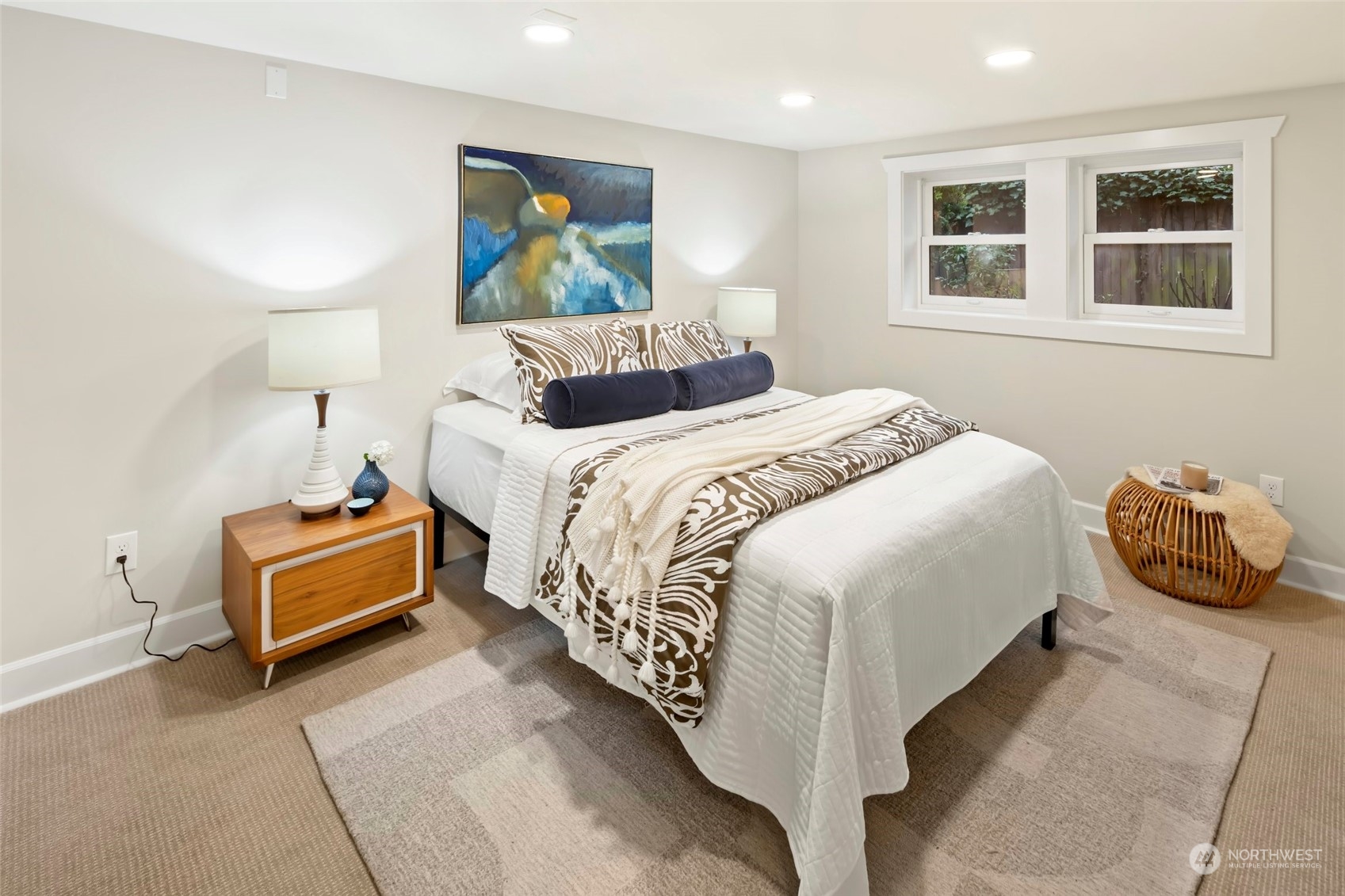 2226 12th Avenue East Seattle, WA 98102 - Photo 19 of 37 a bedroom with a bed and a painting on the wall
