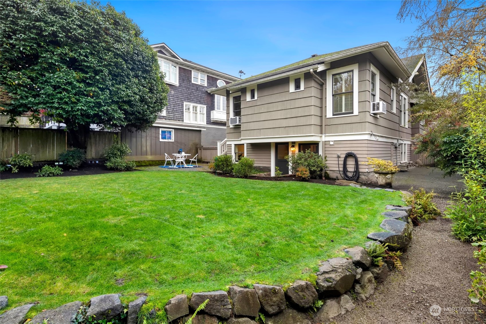 2226 12th Avenue East Seattle, WA 98102 - Photo 2 of 37 a front view of a house with a yard and trees