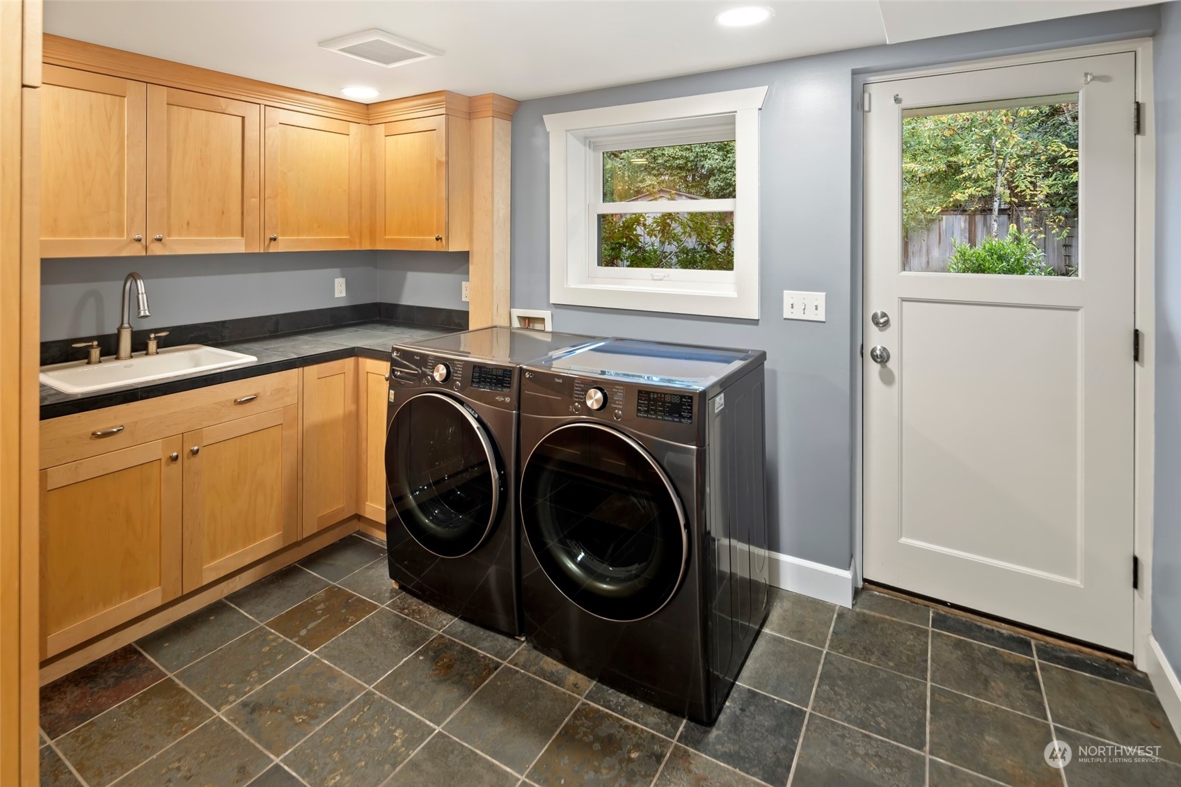 2226 12th Avenue East Seattle, WA 98102 - Photo 27 of 37 a utility room with dryer and washer