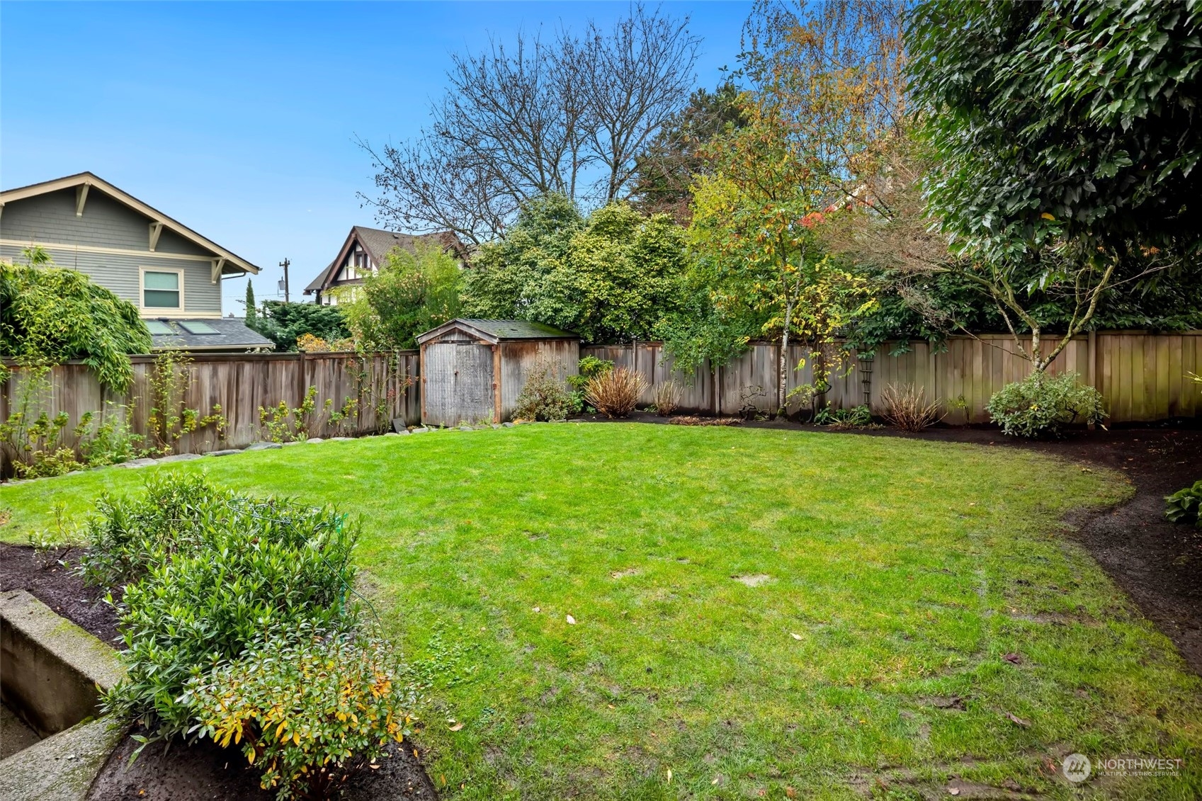 2226 12th Avenue East Seattle, WA 98102 - Photo 29 of 37 a backyard of a house with lots of green space