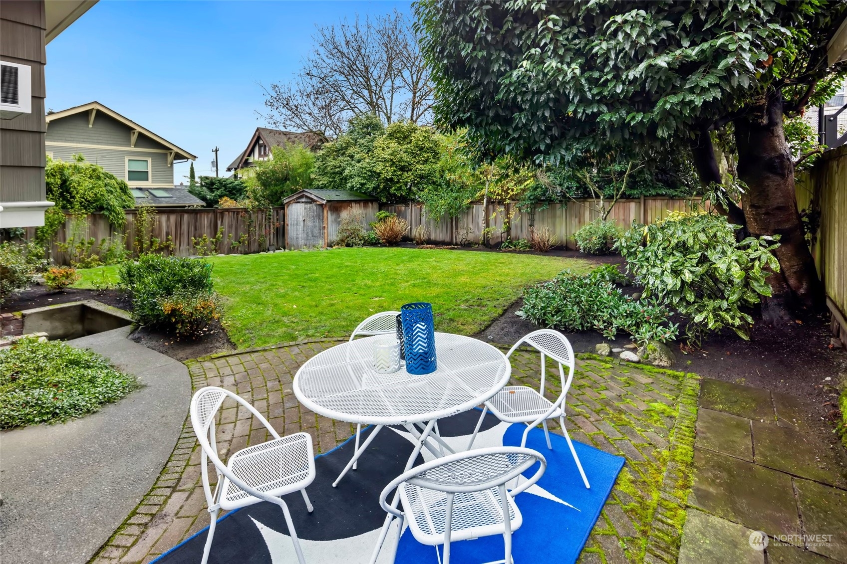 2226 12th Avenue East Seattle, WA 98102 - Photo 3 of 37 a table and chairs in the garden
