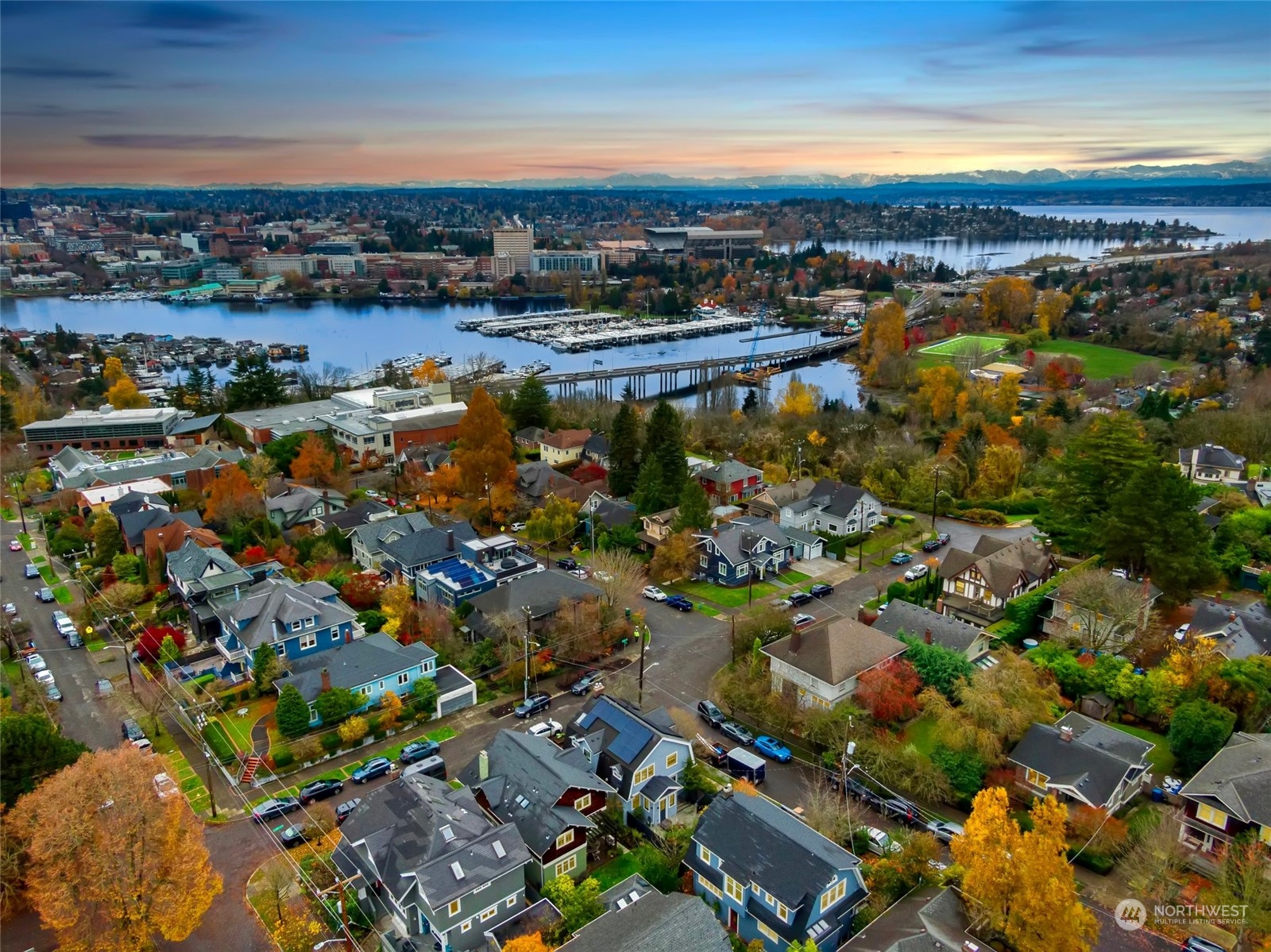 2226 12th Avenue East Seattle, WA 98102 - Photo 36 of 37 an aerial view of a city with lots of residential buildings and ocean view in back