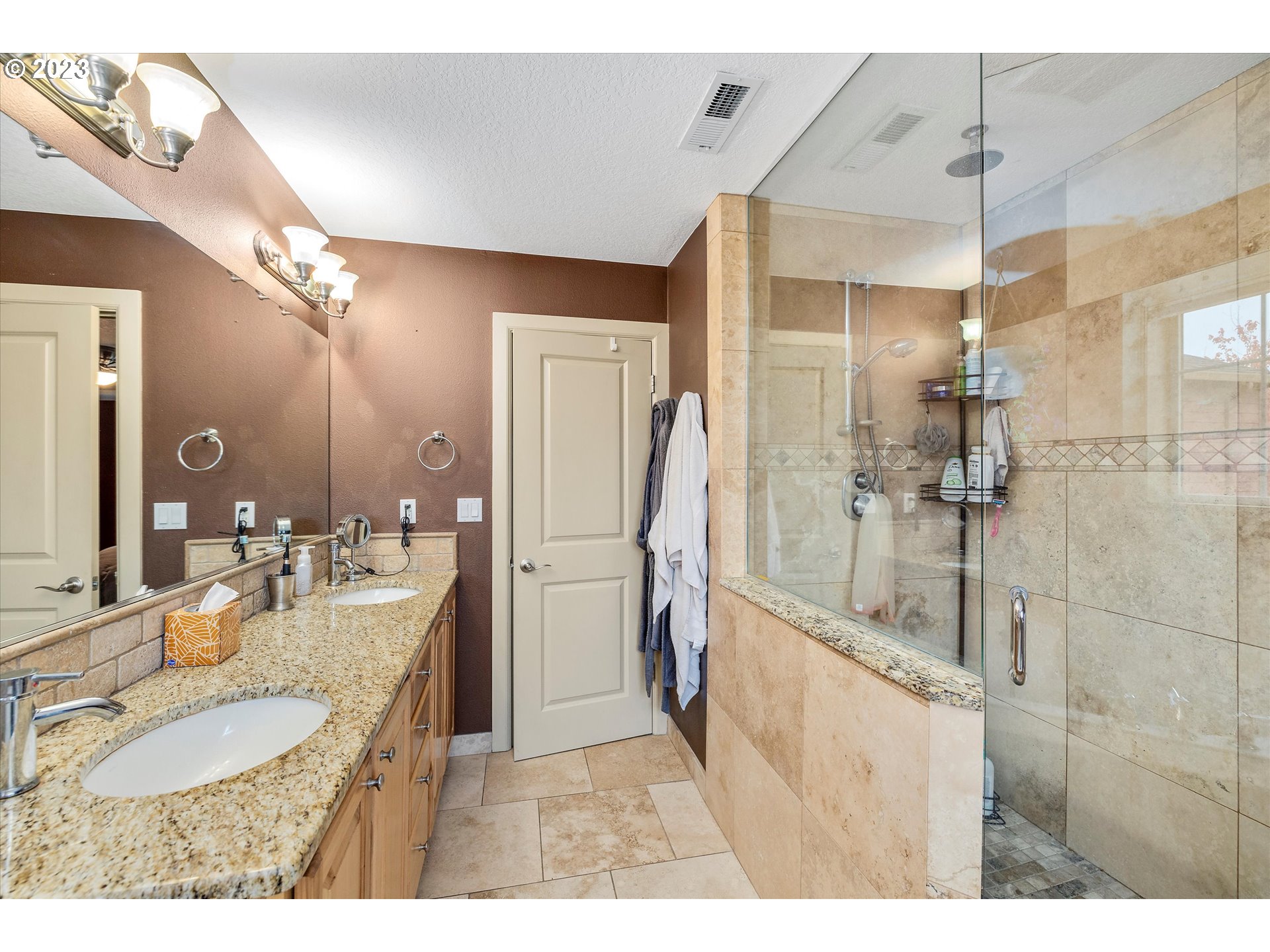 16472 Southeast Siri Loop Damascus, OR 97089 - Photo 21 of 41 a bathroom with a granite countertop sink mirror and shower
