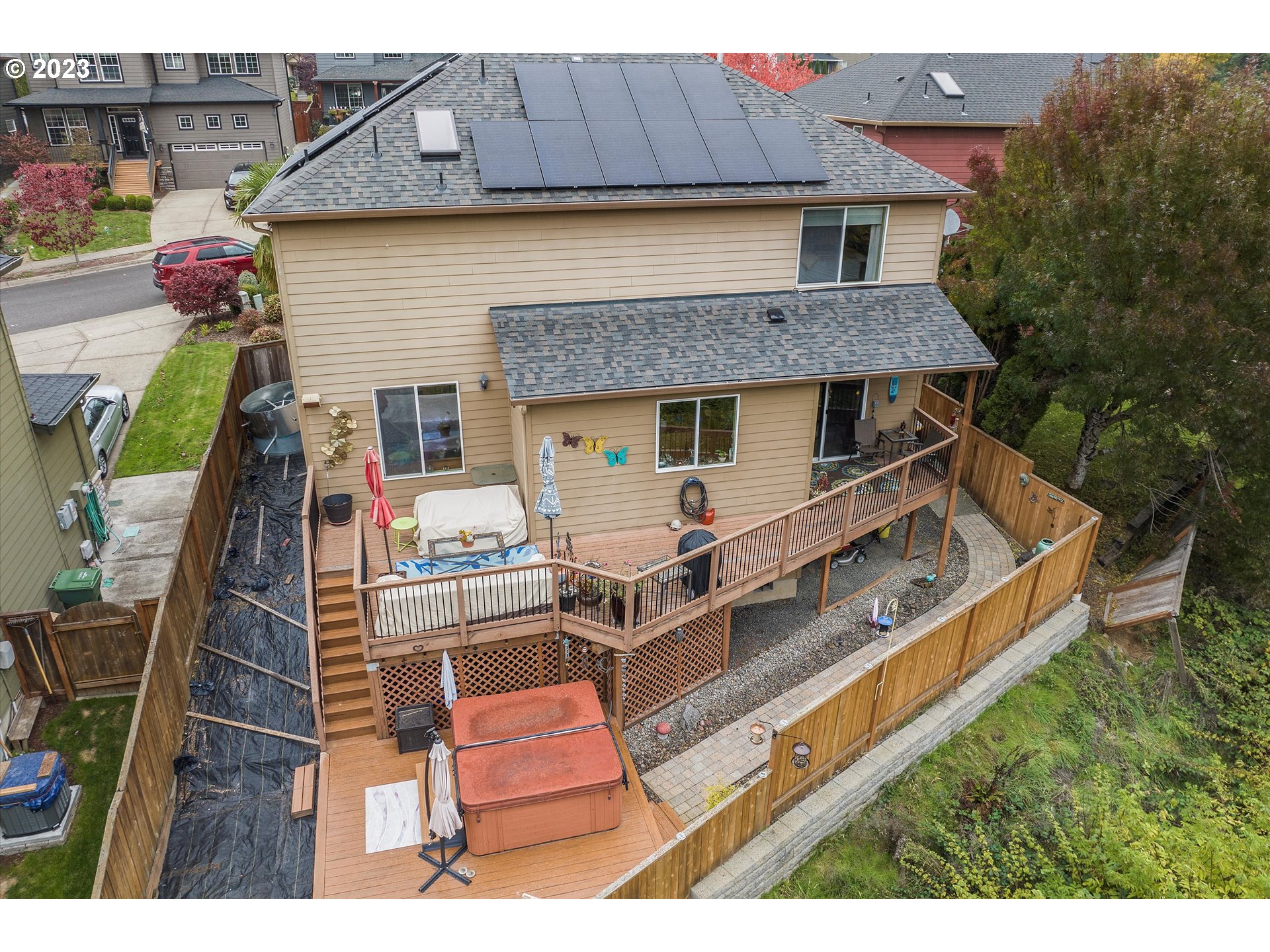 16472 Southeast Siri Loop Damascus, OR 97089 - Photo 39 of 41 a view of a chairs and table in the backyard