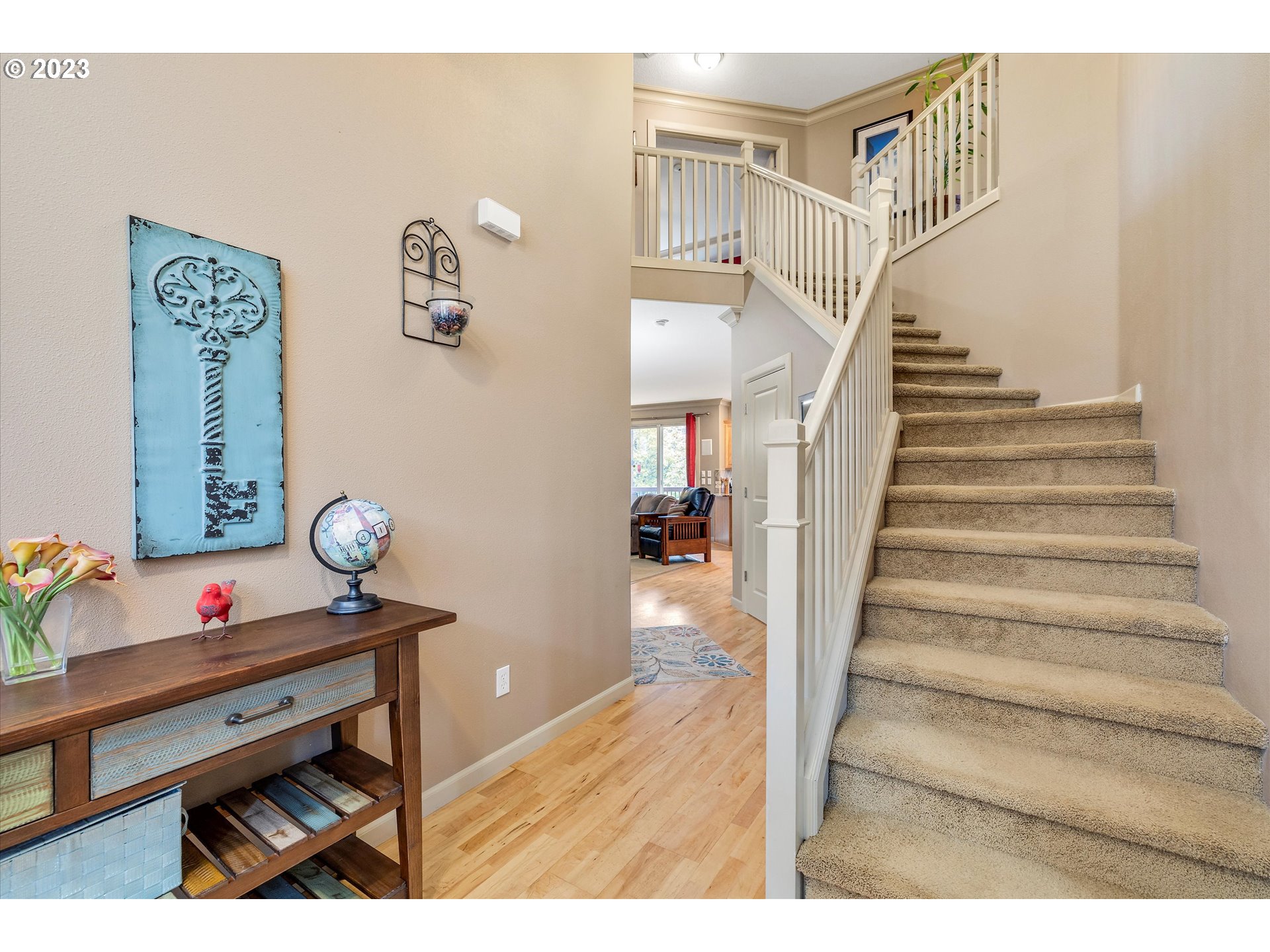 16472 Southeast Siri Loop Damascus, OR 97089 - Photo 5 of 41 a view of entryway with furniture and wooden floor
