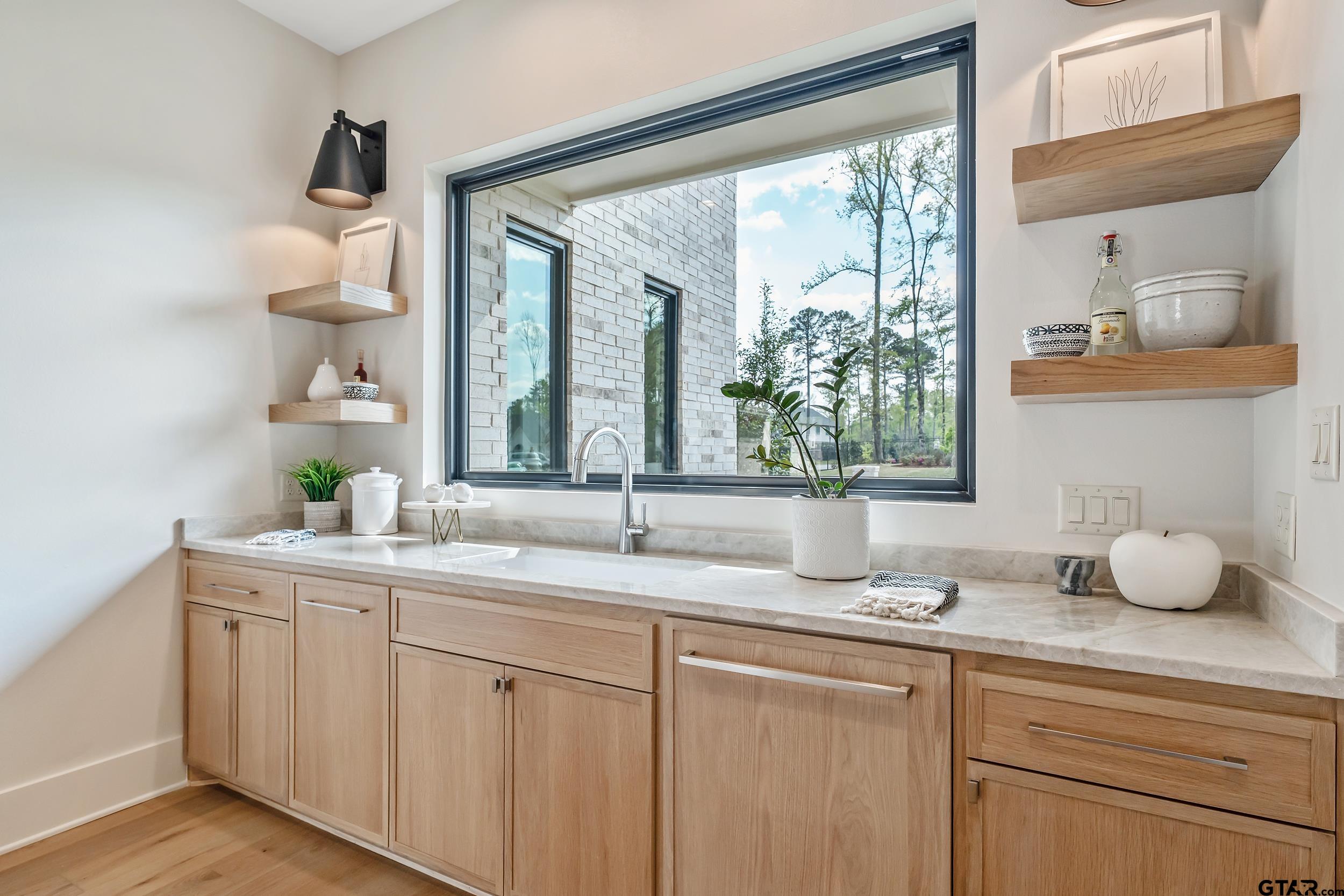 1409 Canopy Cv Court Tyler, TX 75703 - Photo 11 of 40 a bathroom with a granite countertop sink mirror and window