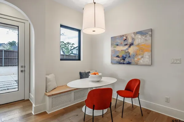 a bathroom with a toilet a sink and a mirror