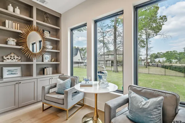 a bathroom with a sink mirror and vanity