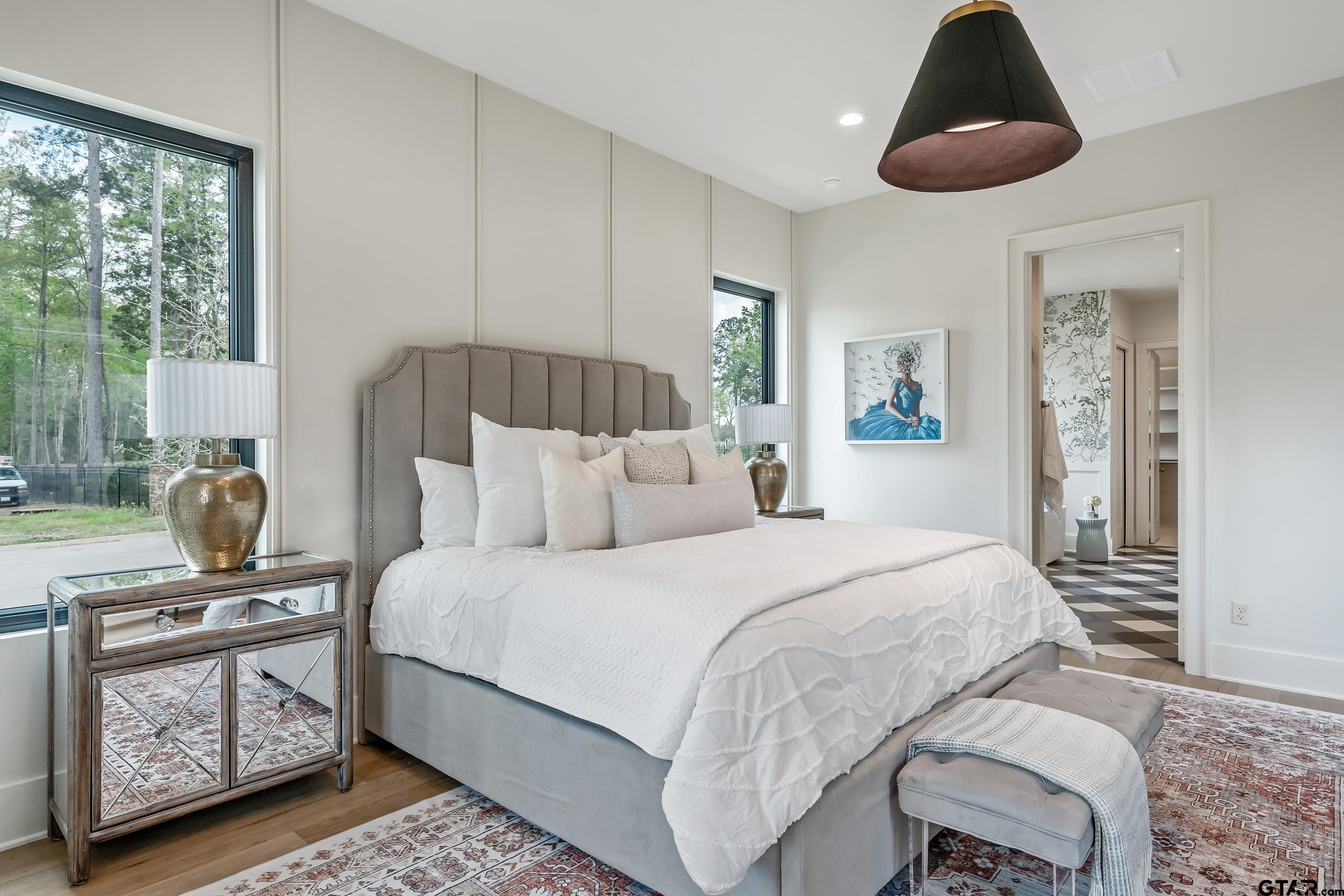 1409 Canopy Cv Court Tyler, TX 75703 - Photo 19 of 40 a bedroom with a bed and wooden floor