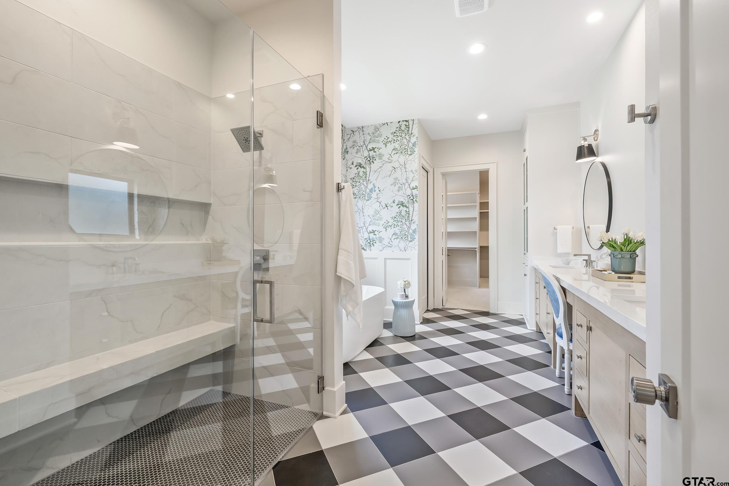 1409 Canopy Cv Court Tyler, TX 75703 - Photo 20 of 40 a bathroom with a double vanity sink a toilet and shower