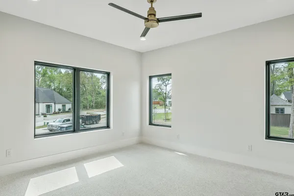 a view of an empty room and a window
