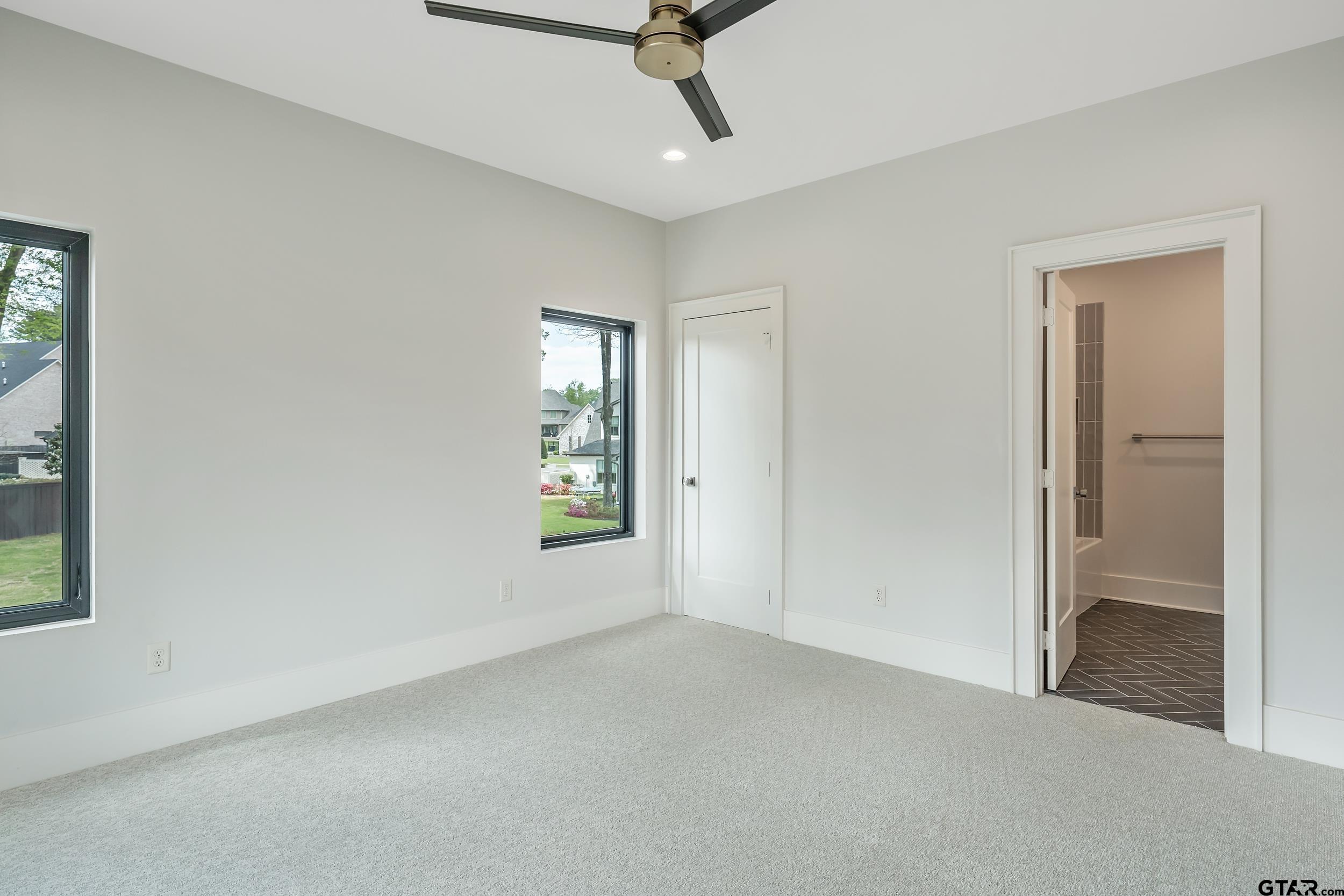 1409 Canopy Cv Court Tyler, TX 75703 - Photo 26 of 40 an empty room with windows and closet