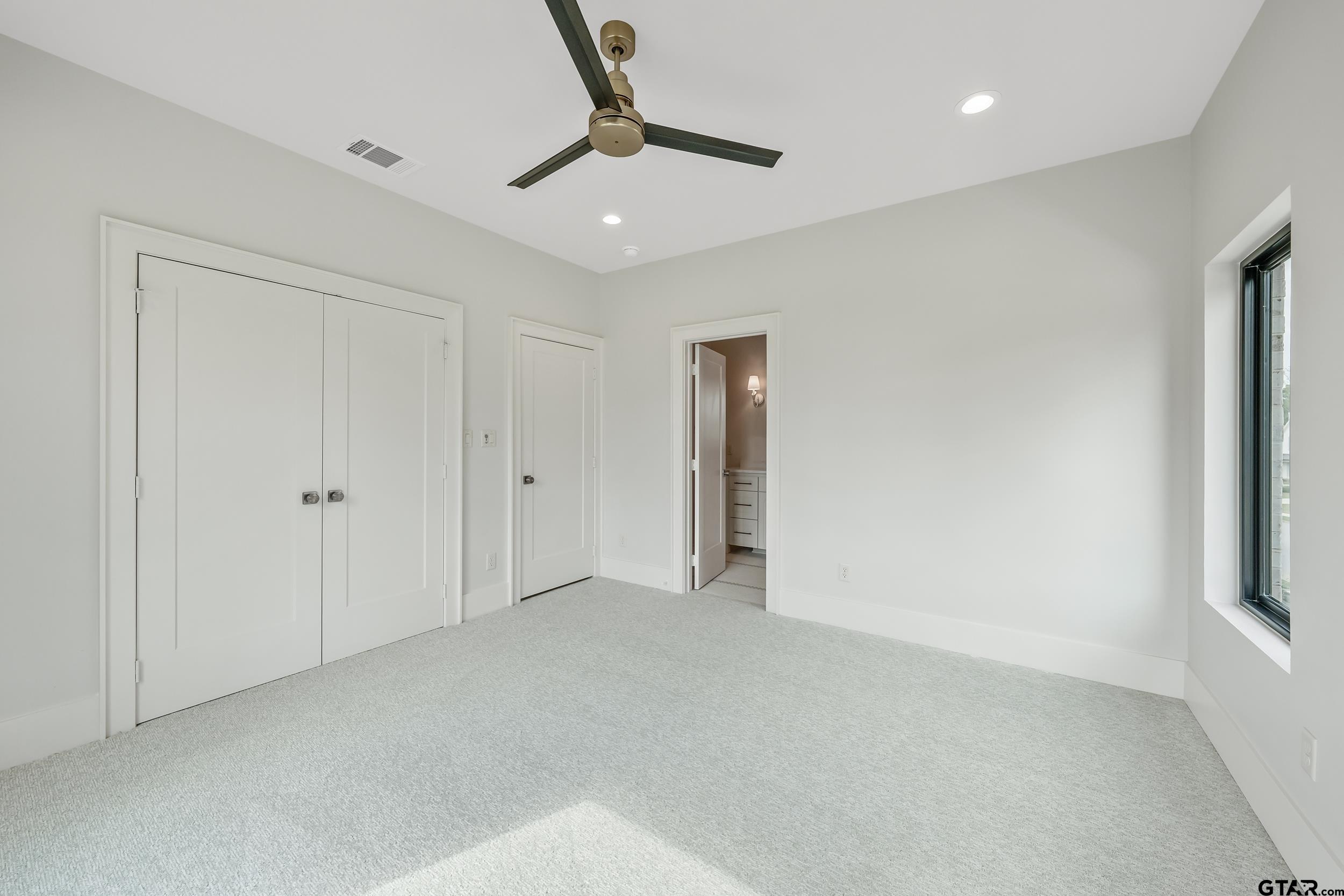 1409 Canopy Cv Court Tyler, TX 75703 - Photo 30 of 40 a view of an empty room and a window