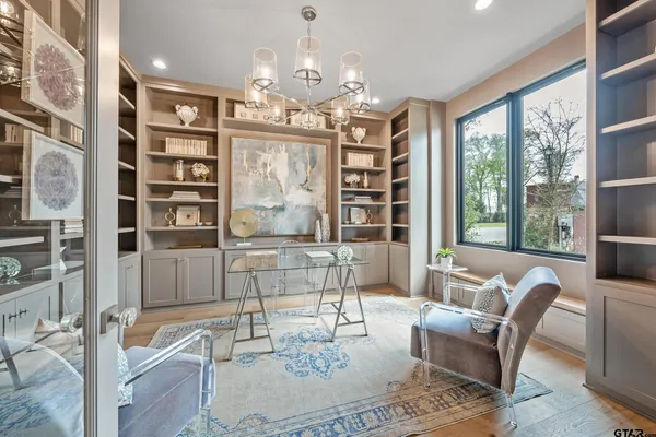a dining room with furniture and wooden floor