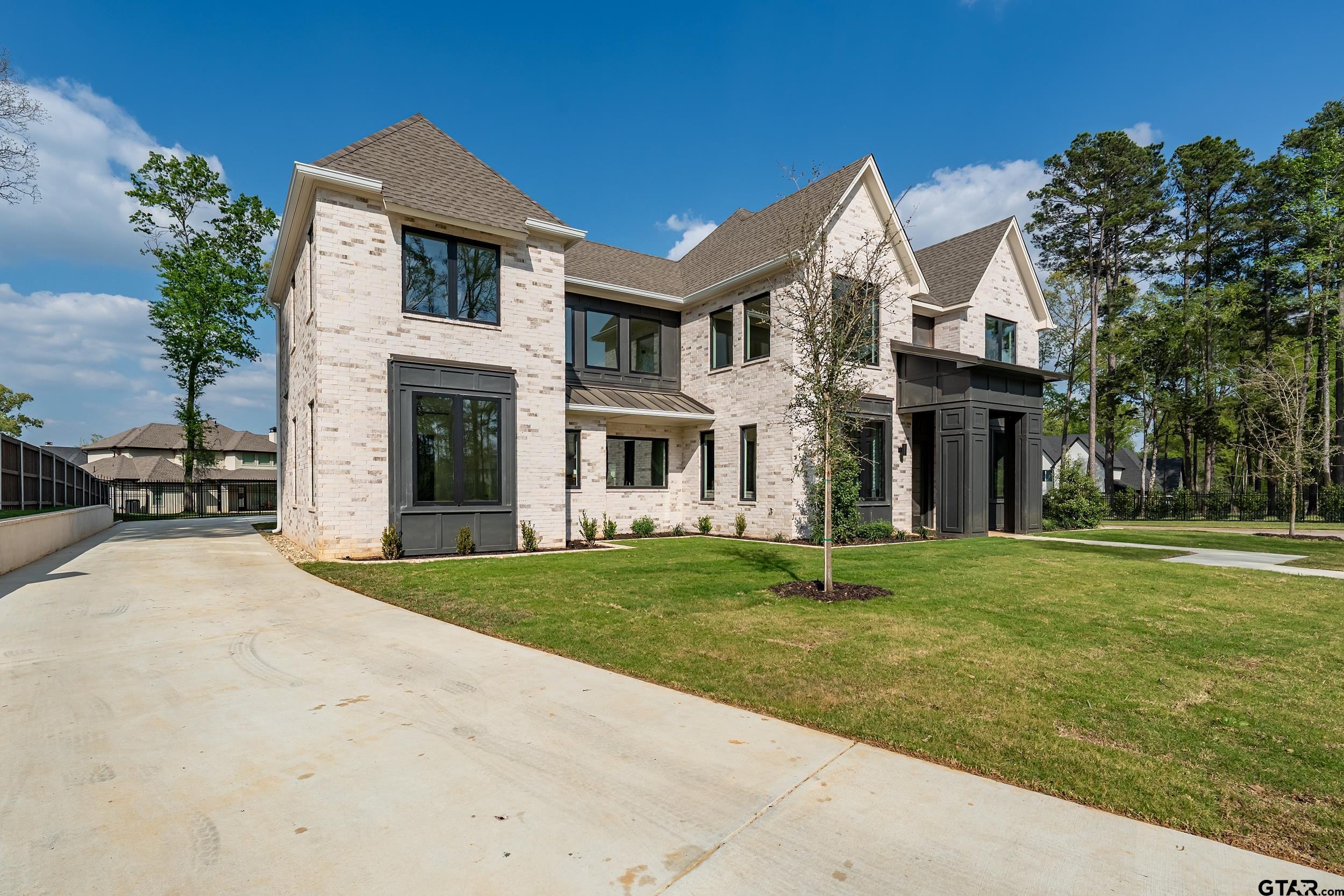 1409 Canopy Cv Court Tyler, TX 75703 - Photo 38 of 40 a front view of a house with a yard