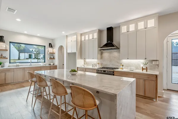 a kitchen with a stove and a refrigerator