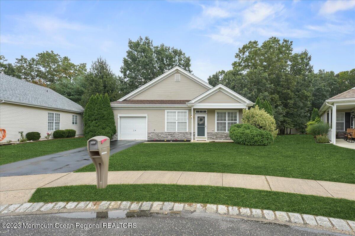 169 Sandpiper Road Barnegat, NJ 08005 - Photo 1 of 35 a front view of a house with a yard and garage