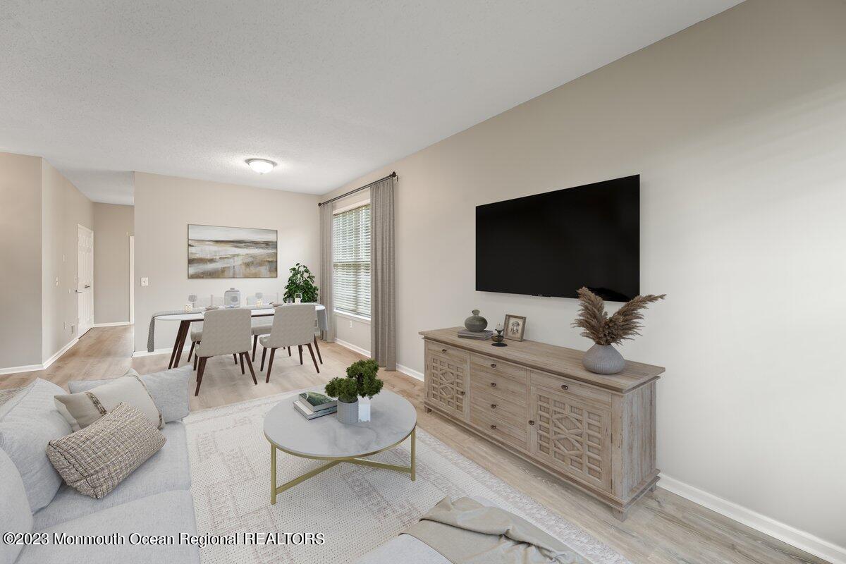 169 Sandpiper Road Barnegat, NJ 08005 - Photo 8 of 35 a living room with furniture and a flat screen tv