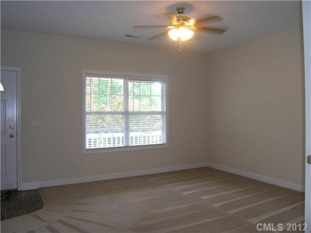 5767 Grassy Creek Road Denver, NC 28037 - Photo 5 of 11 a view of empty room with window