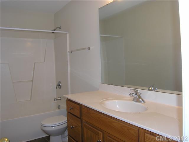 5767 Grassy Creek Road Denver, NC 28037 - Photo 7 of 11 a bathroom with a sink toilet and shower