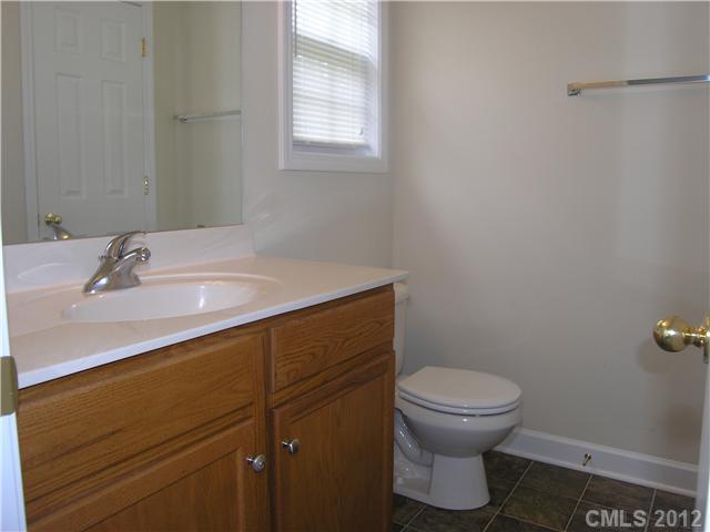 5767 Grassy Creek Road Denver, NC 28037 - Photo 9 of 11 a bathroom with a sink and a toilet