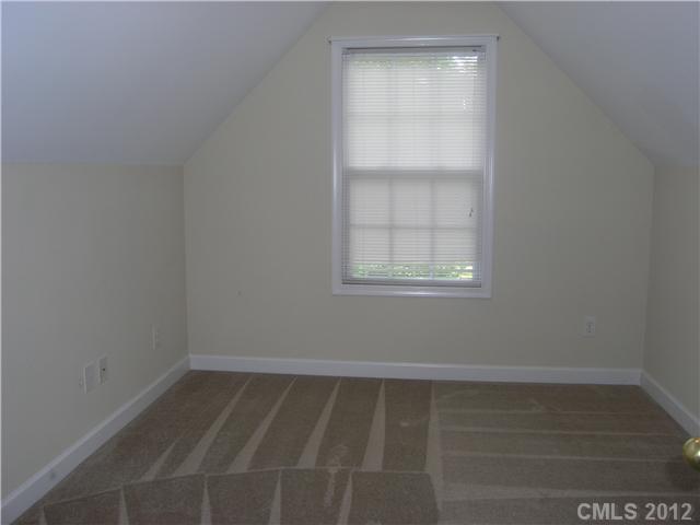 5767 Grassy Creek Road Denver, NC 28037 - Photo 10 of 11 a view of an empty room with a window