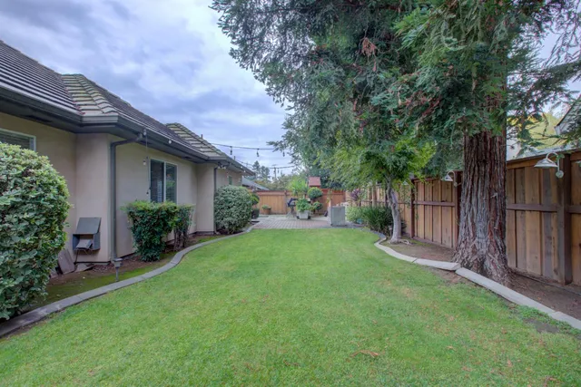 a front view of a house with sitting area