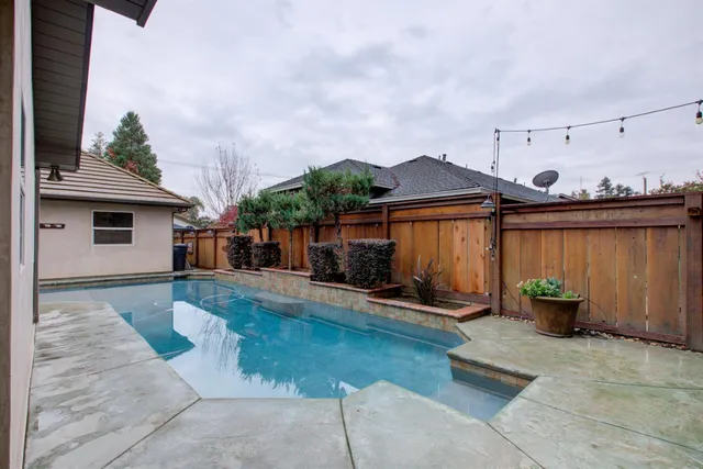 a bedroom with furniture and a ceiling fan