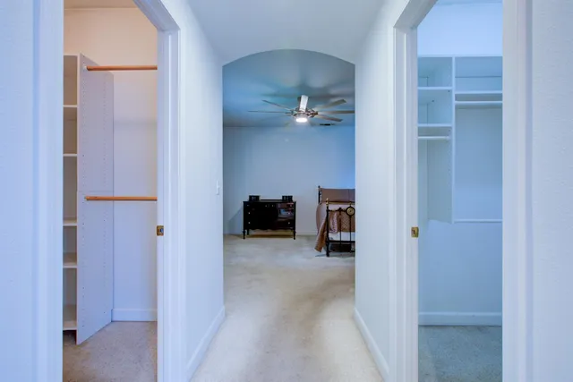 a bathroom with a tub a sink and a mirror