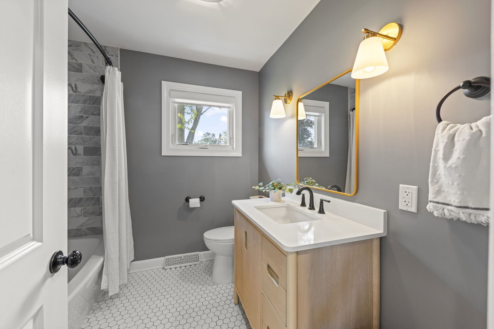 26-w079 Thomas Road Wheaton, IL 60187 - Photo 18 of 32 a bathroom with a sink and a mirror