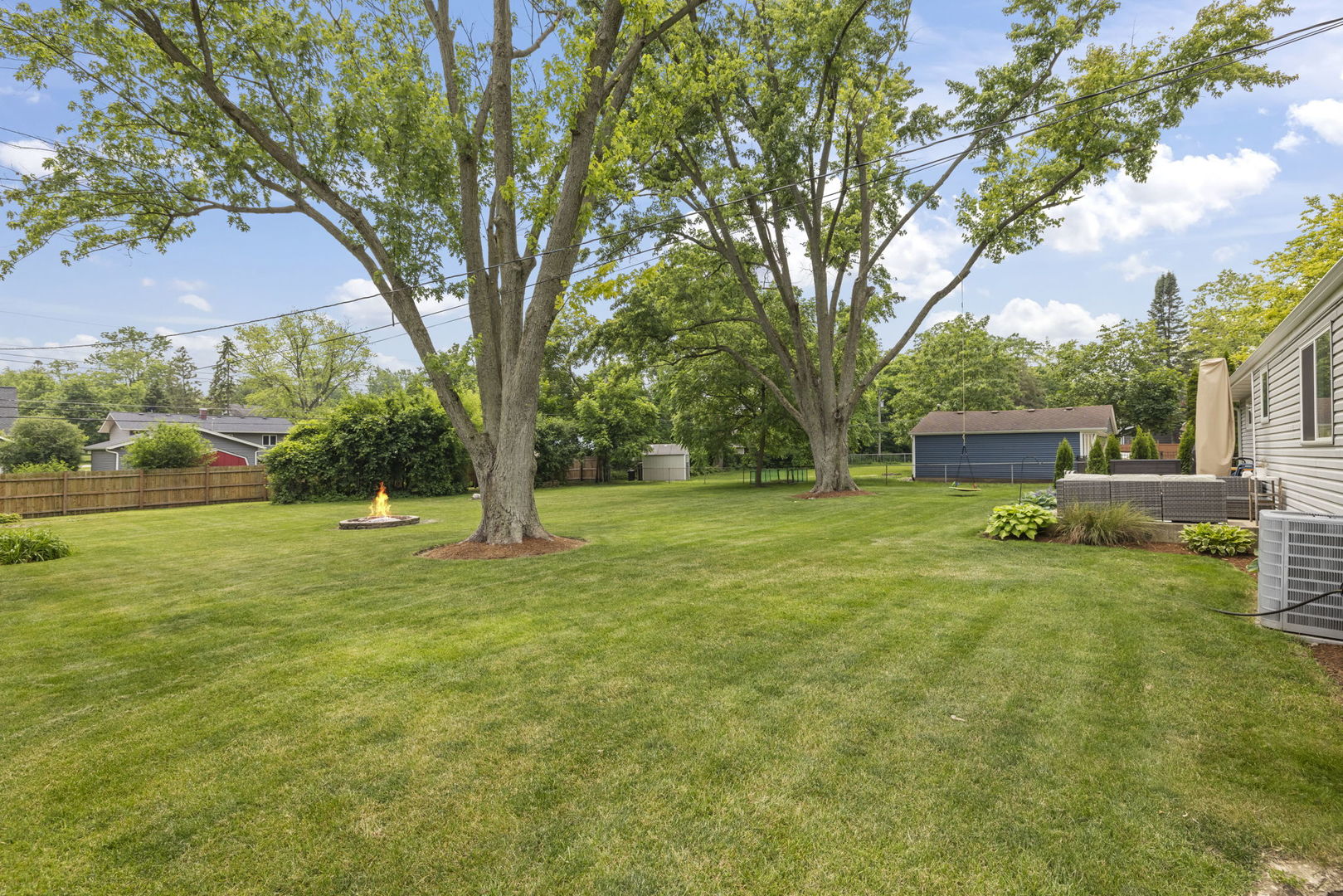 26-w079 Thomas Road Wheaton, IL 60187 - Photo 27 of 32 a yellow house in middle of the forest