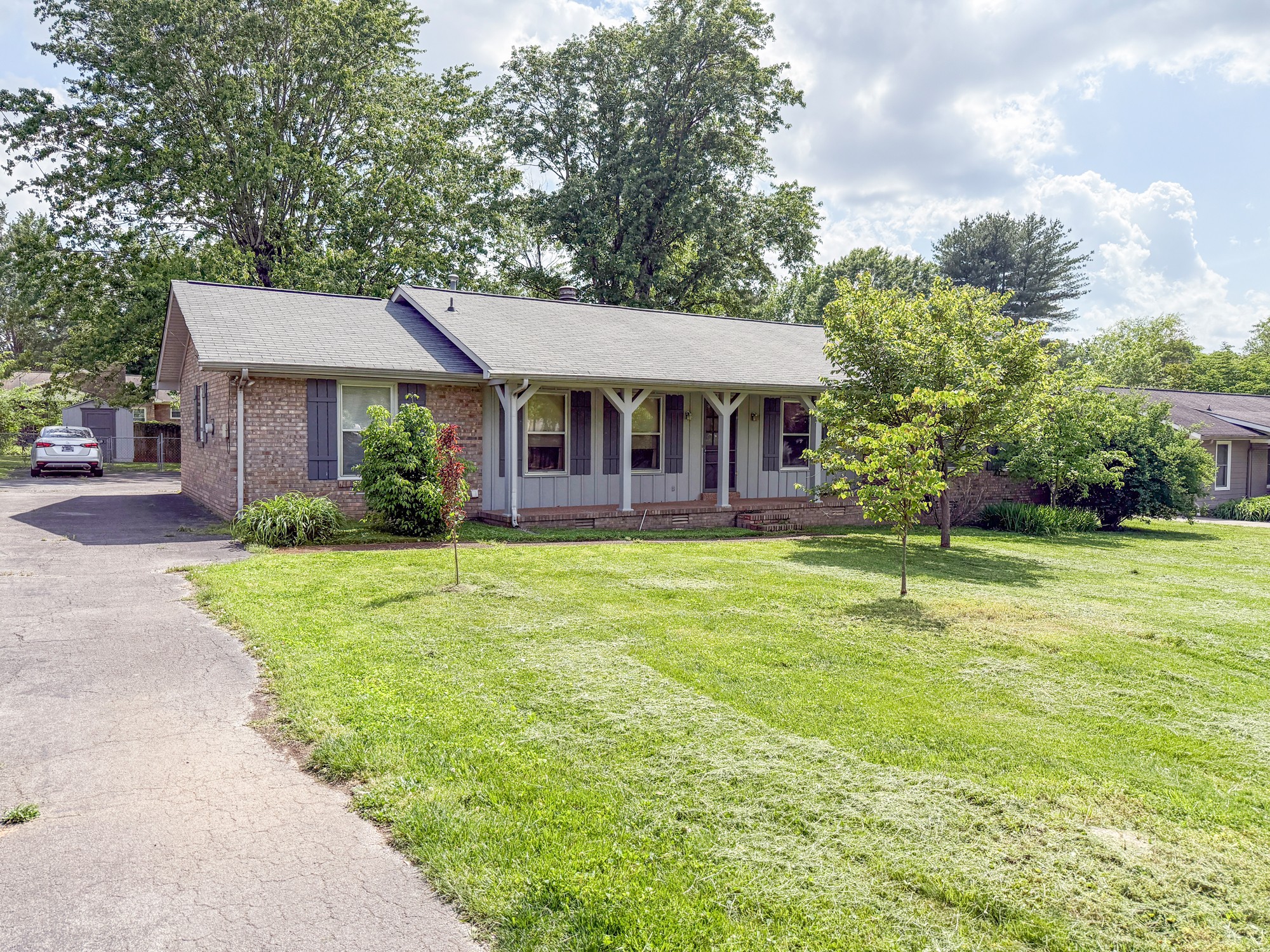 1431 Avon Road Murfreesboro, TN 37129 - Photo 1 of 4 a front view of a house with a yard