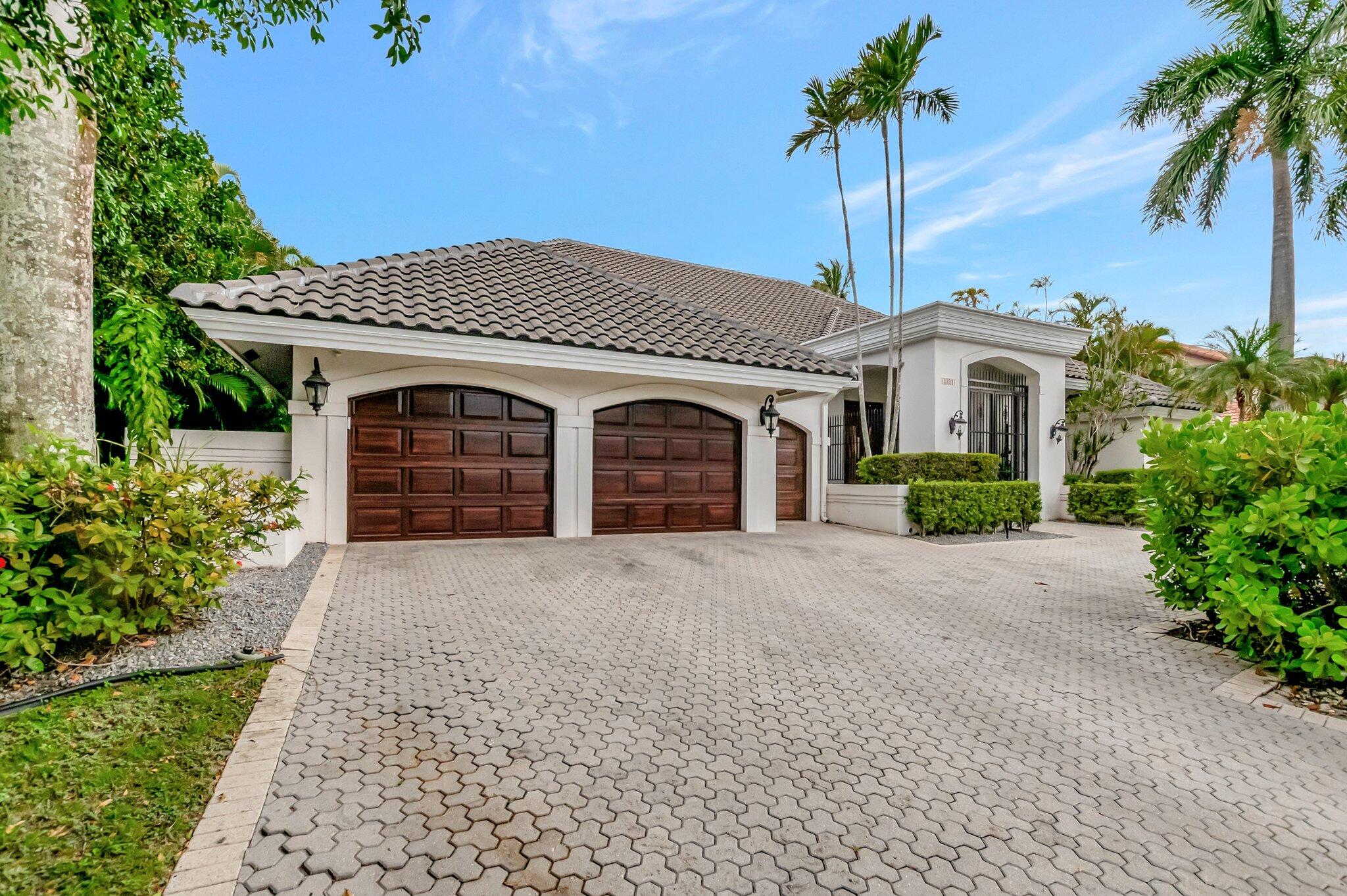 2393 Northwest 59th Street Boca Raton, FL 33496 - Photo 2 of 87 driveway/garage
