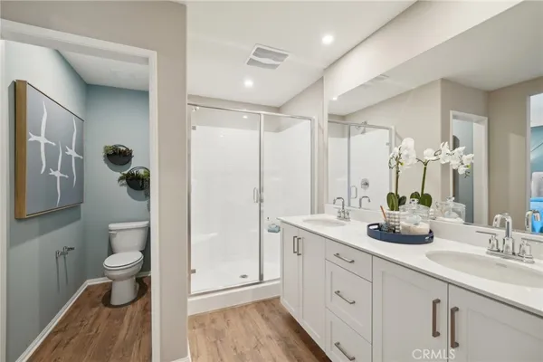 a bathroom with a sink a mirror and a shower