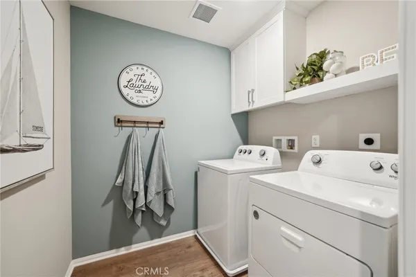 a picture of a room with a white wall and a large window