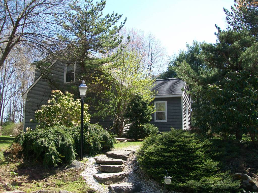 a backyard of a house with lots of green space